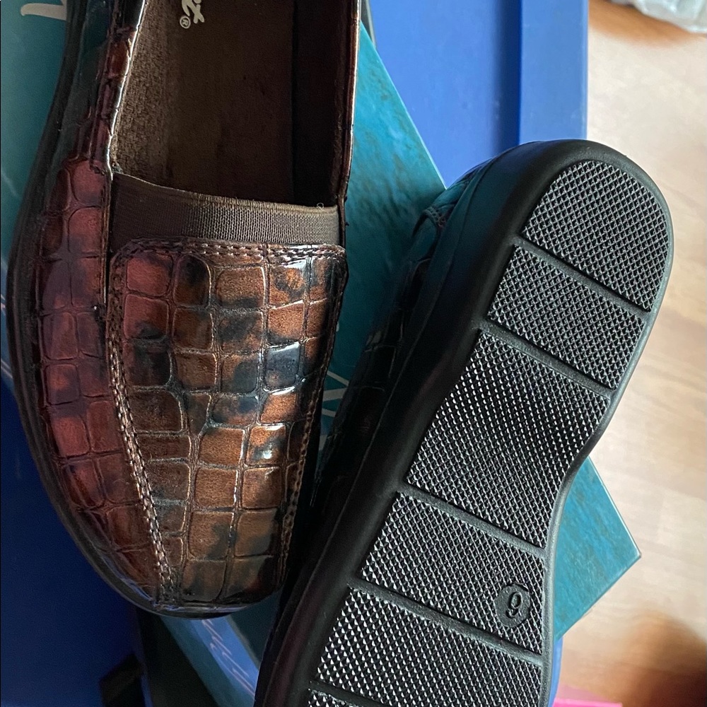 Brown and black loafer